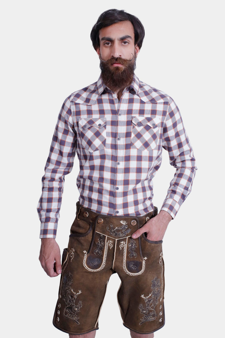 Man wearing "Chestnut Oak" lederhosen in smoky used-brown, with traditional Bavarian embroidery.