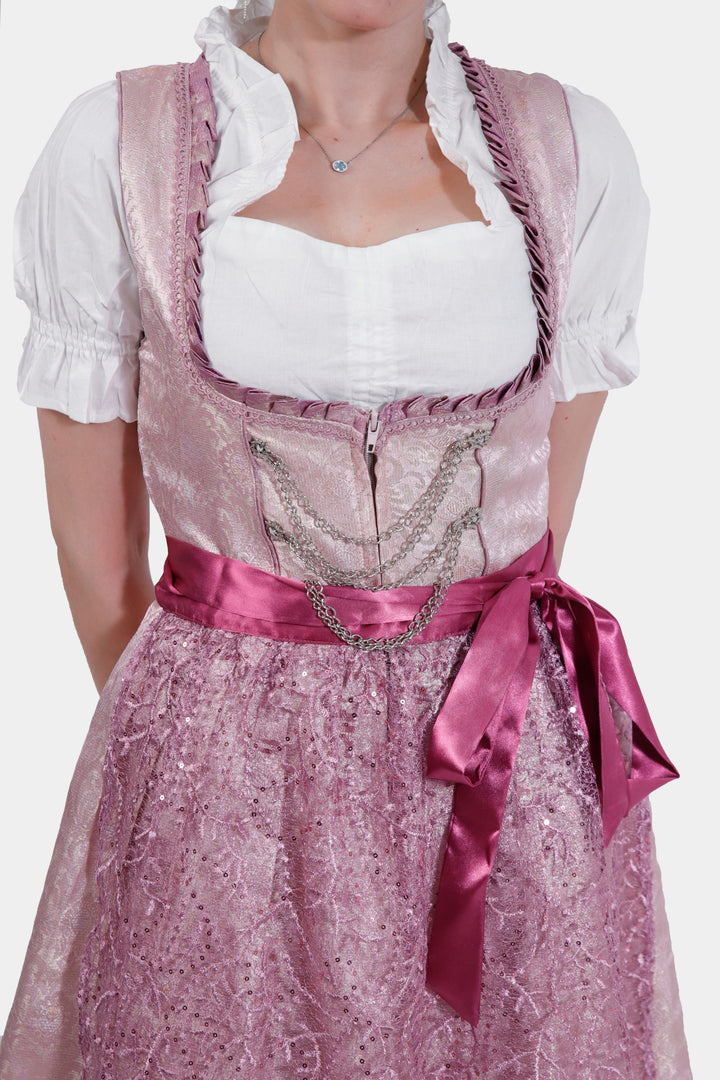 Close-up view of Dirndl Jessica Schwarz showing detailed lace patterns on the apron and sparkling embellishments on the bodice.