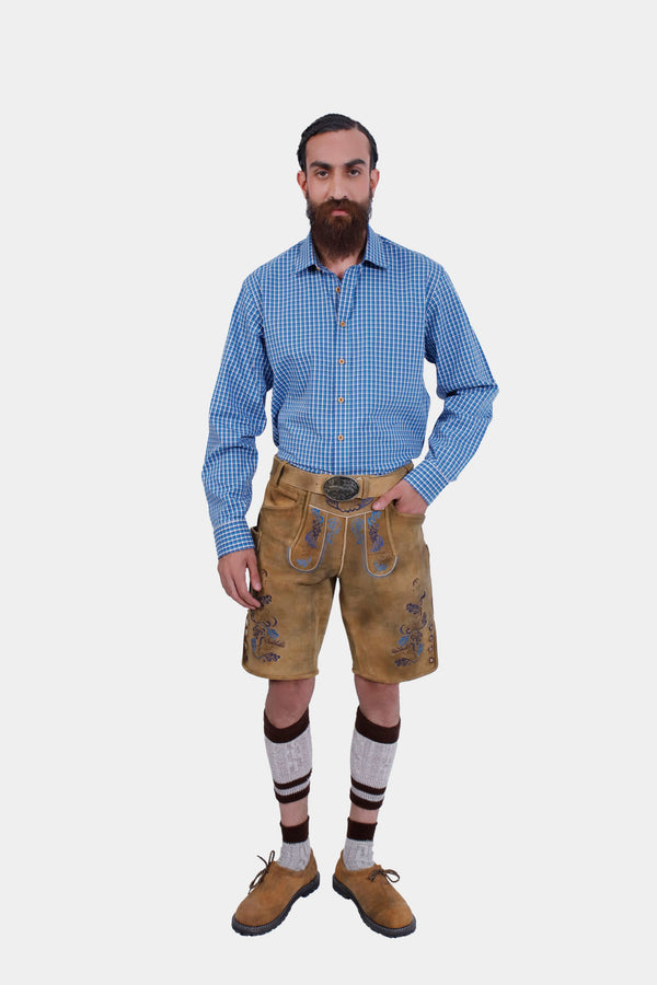 A man standing with his back facing the camera, displaying the rear design of the Edelweiss Lederhosen.