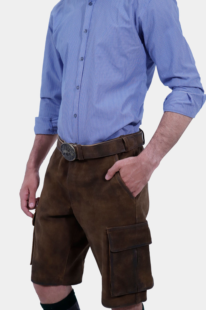 Close-up of a man wearing Hallstatt Cargo Lederhosen, highlighting the intricate detailing and side pockets of the brown leather shorts.