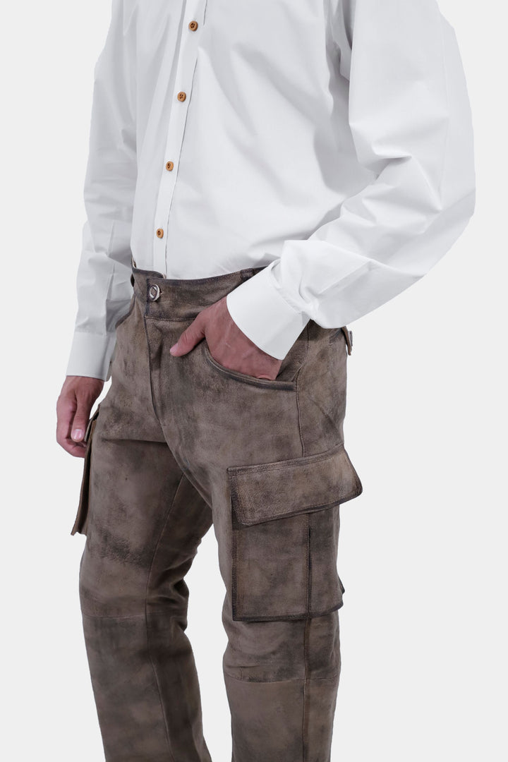 Side view of a person wearing Königssee Cargo Lederhosen Long Pant, showcasing the cargo pockets, paired with a white button-up shirt.