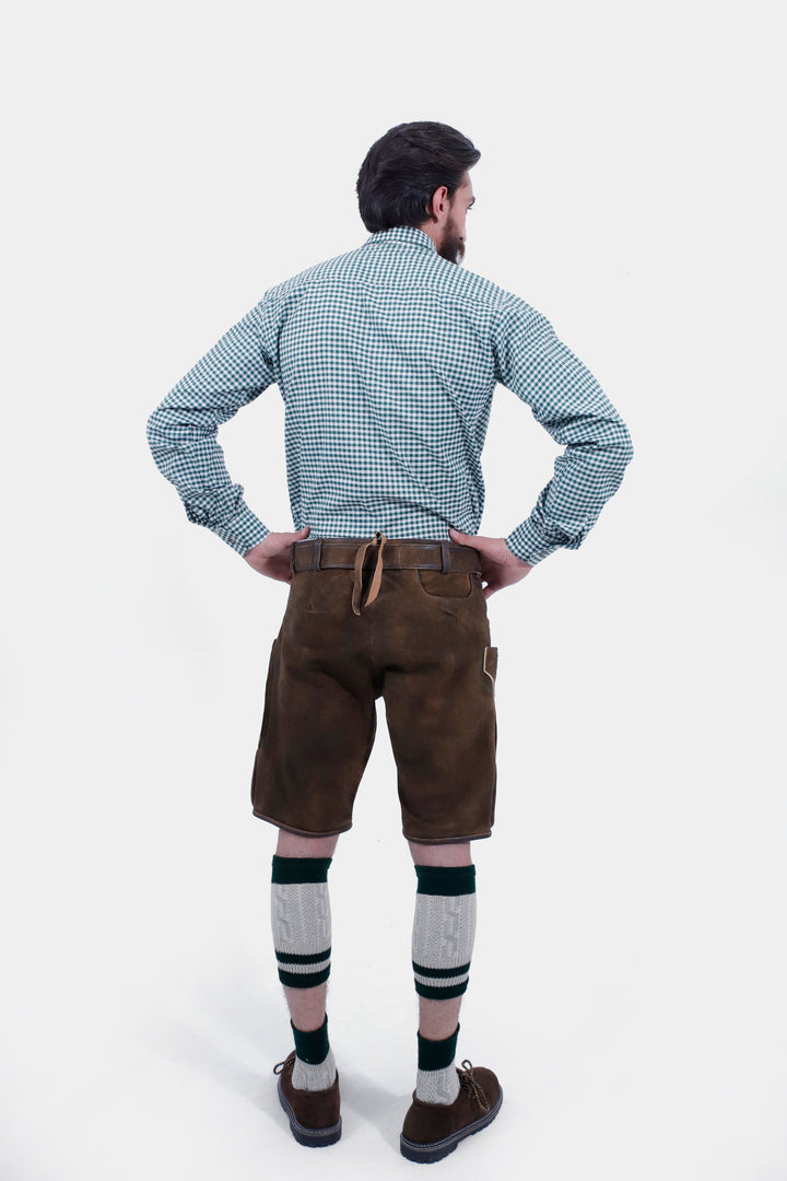 Back view of the man wearing the Mahler Lederhosen, showcasing the leather material and the design on the back pockets.