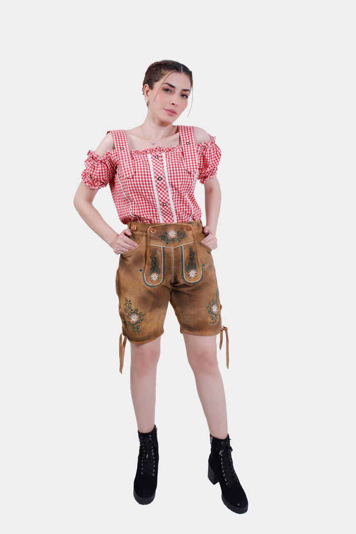 Full-length image of a woman wearing Munich Majesty lederhosen, showing the complete outfit with a white shirt and high heels.