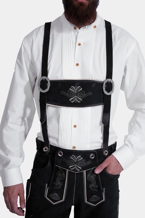 man wearing lederhosen suspenders