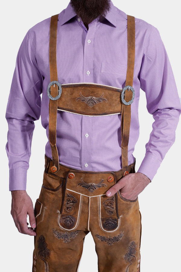 man wearing traditional lederhosen suspenders