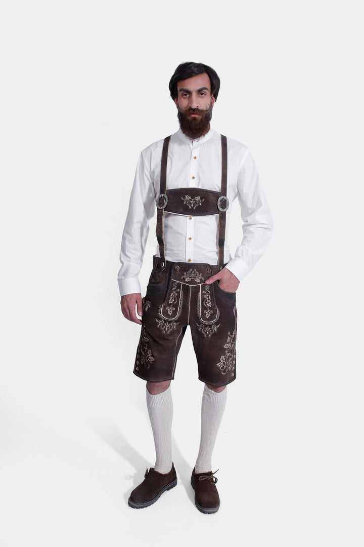 complete view of a man wearing traditional lederhosen suspenders