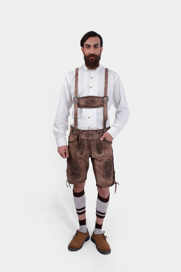 complete view of a man wearing traditional lederhosen suspenders