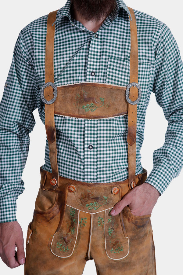 man wearing traditional lederhosen suspenders