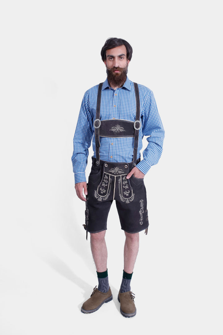 complete view of a man wearing traditional lederhosen suspenders