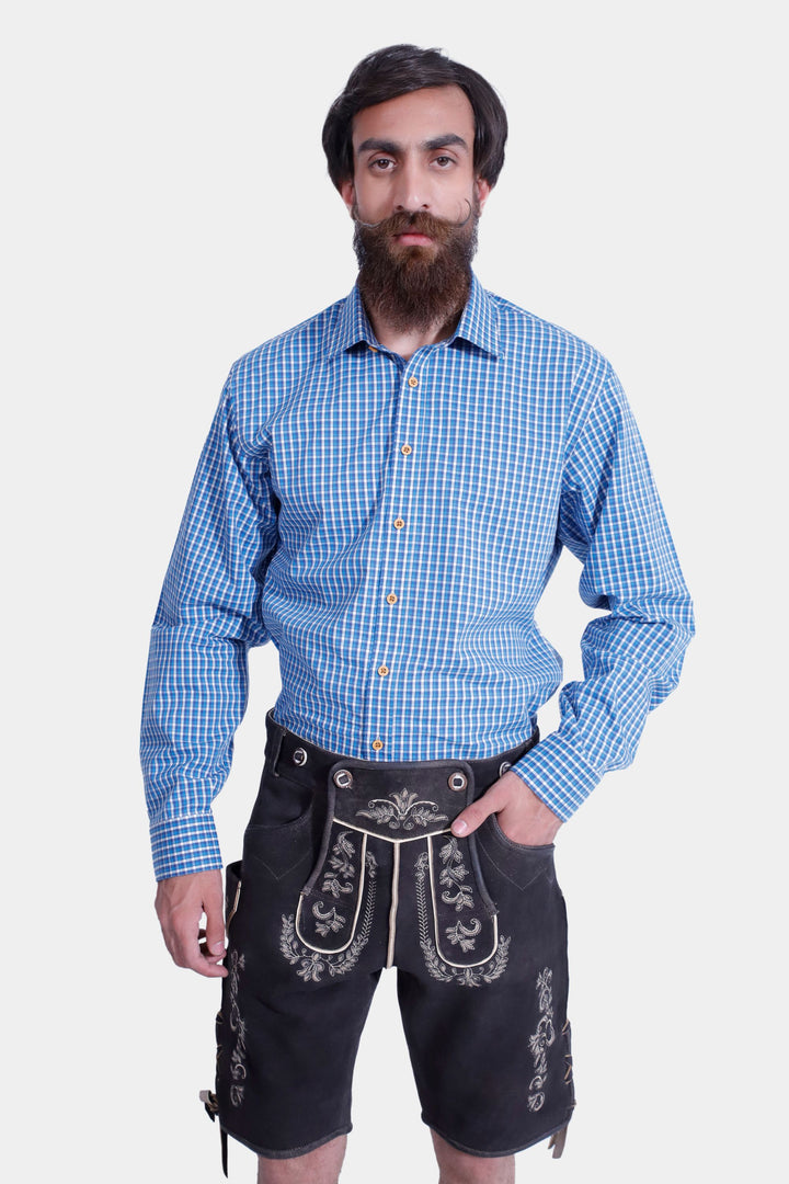 Front view of a man wearing Versailles Lederhosen with a blue checkered shirt, showcasing the detailed embroidery and traditional Bavarian style.