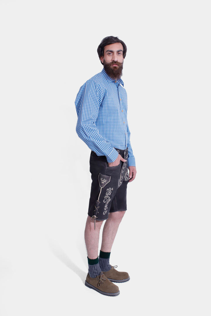 Three-quarter view of a man in Versailles Lederhosen, showcasing the fit and traditional Bavarian style with embroidered details.