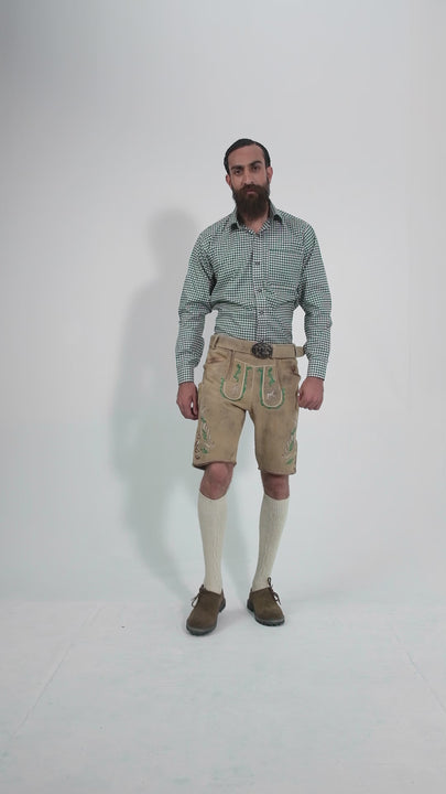 Man showcasing Luther Lederhosen, rotating to display all angles of the outfit, including front, side, and back views.