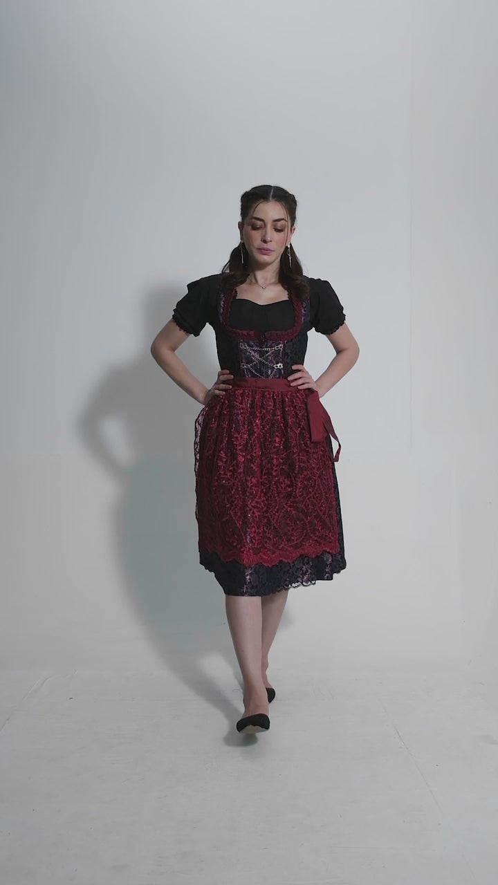 Video showcasing a woman modeling the Dirndl Kelly, rotating to display all angles and details of the traditional yet stylish outfit.