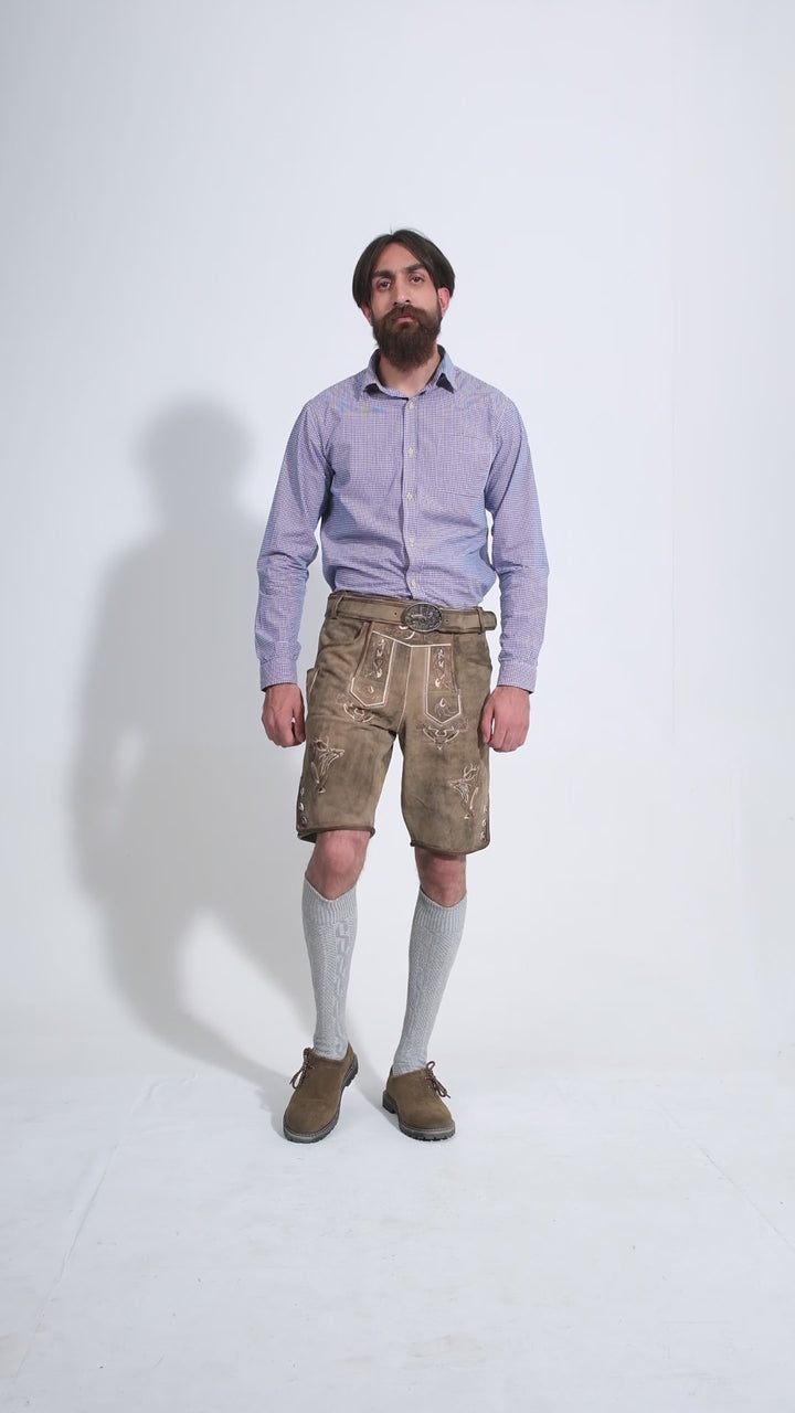 Man showcasing Bodensee Lederhosen, rotating to display all angles of the outfit, including front, side, and back views.