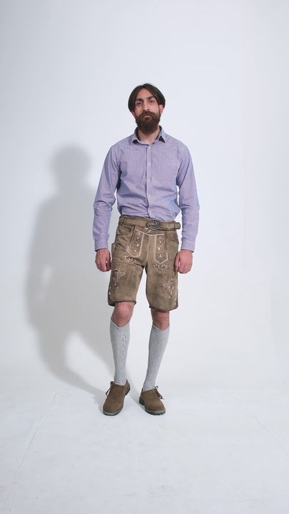 Man showcasing Bodensee Lederhosen, rotating to display all angles of the outfit, including front, side, and back views.