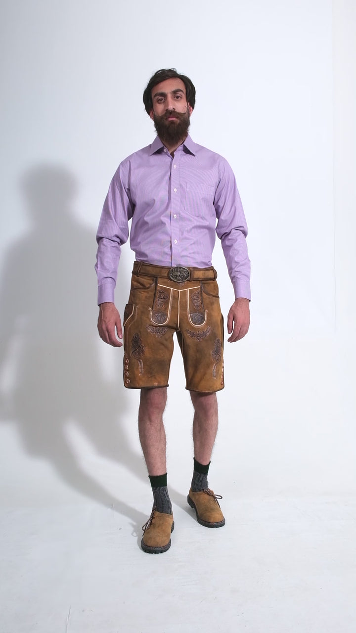 Man showcasing Rubens Lederhosen, rotating to display all angles of the outfit, including front, side, and back views.