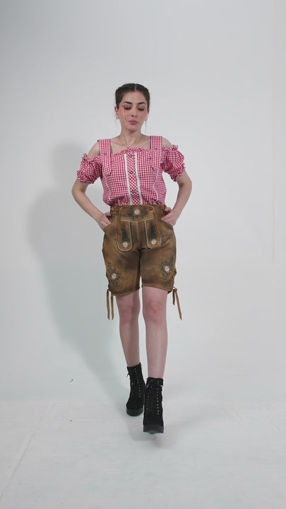 Showcase video of the Munich Majesty Lederhosen, highlighting the product's detailed craftsmanship, rich suede texture, and stylish embroidery through various model poses and close-up shots.