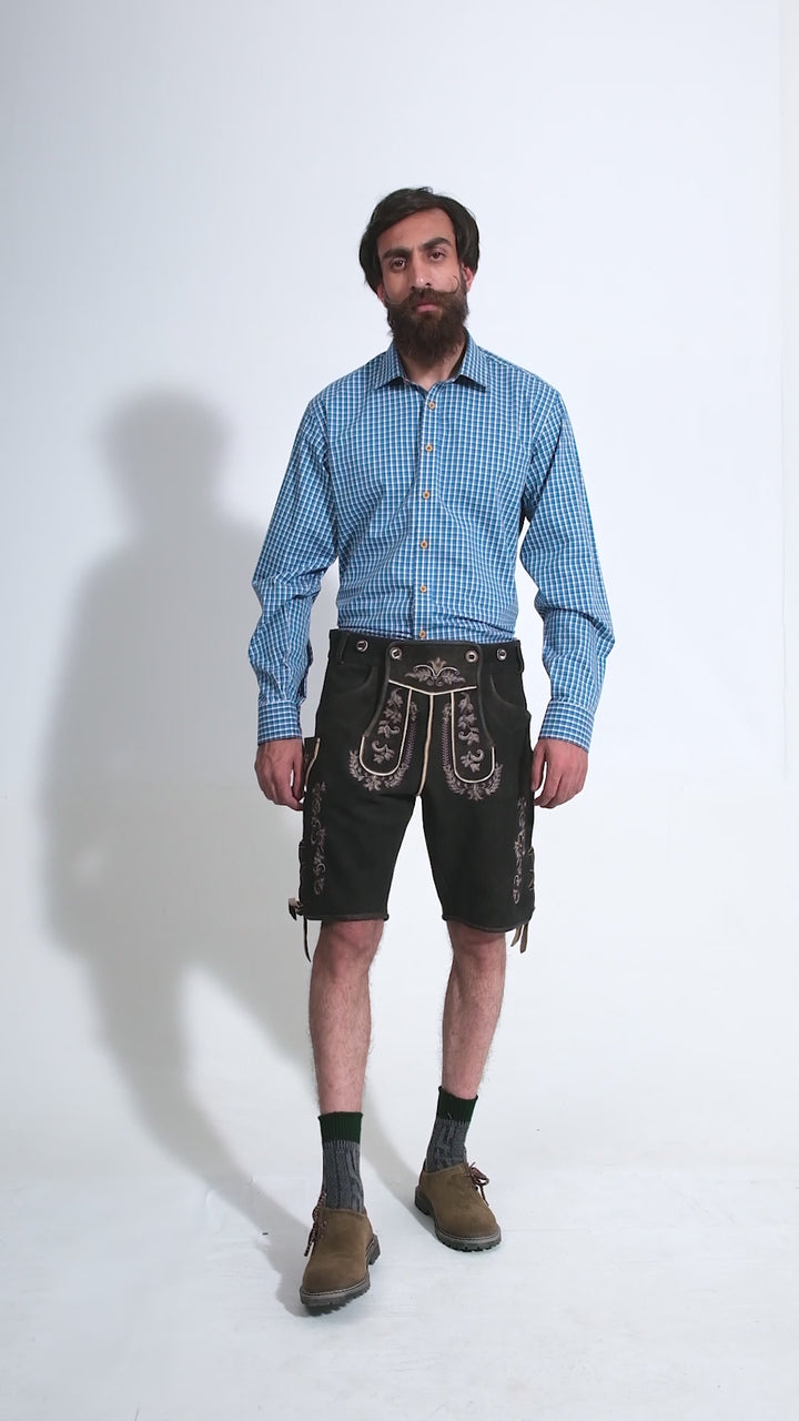 Video showing a 360-degree view of the Versailles Lederhosen worn by a man in a blue checkered shirt, highlighting the detailed craftsmanship, embroidery, and features of the traditional Bavarian leather shorts.