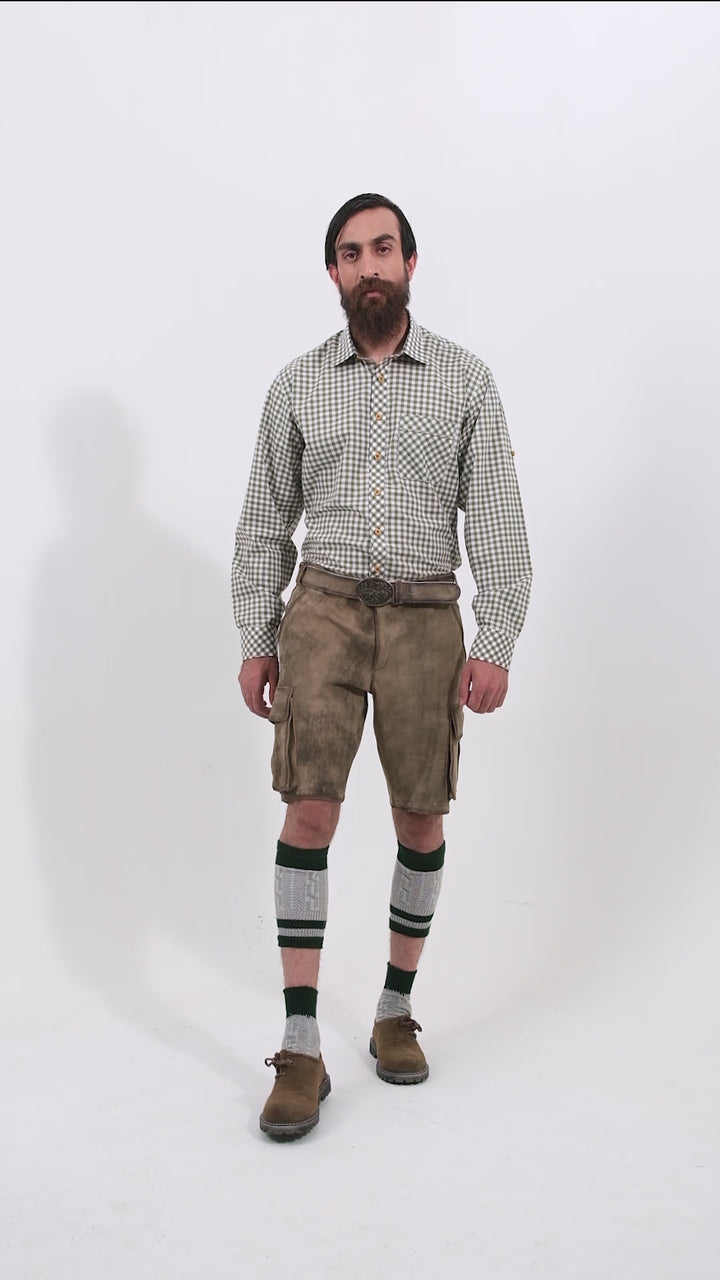 Video showing a 360-degree view of the Klimt Cargo Lederhosen worn by a man, highlighting the detailed craftsmanship, fit, and features of the traditional Bavarian leather shorts.