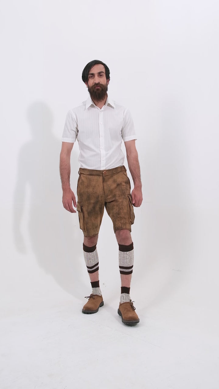 Man showcasing Snowbird Cargo Lederhosen Lederhosen, rotating to display all angles of the outfit, including front, side, and back views.