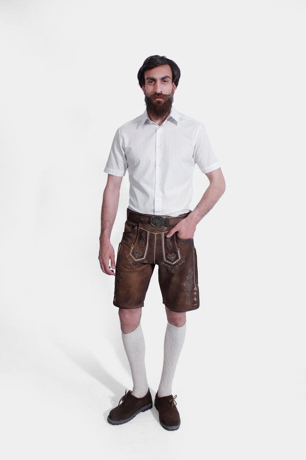 Man wearing "Richard Strauss Lederhosen" in Oakwood Brown with Bavarian embroidery.